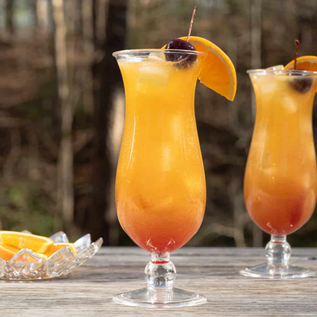 New Orleans style hurricane drinks on an outdoor table.