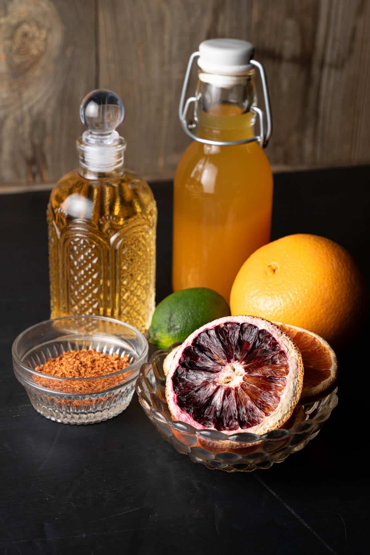 Tequila, passion fruit syrup, orange, lime, tajin, and dried orange slices.