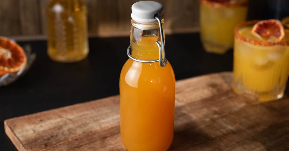 A bottle of homemade passion fruit syrup.