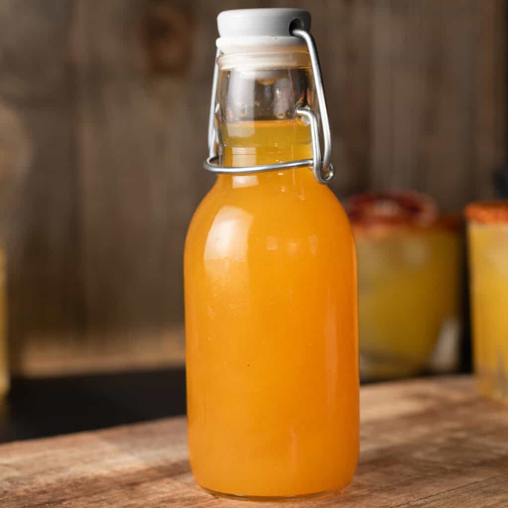 A bottle of homemade passion fruit syrup.