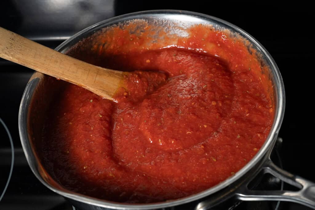 Simmering a pot of homemade pizza sauce.